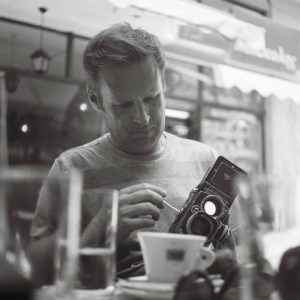 personal-photo-man-with-old-camera-black-and-white