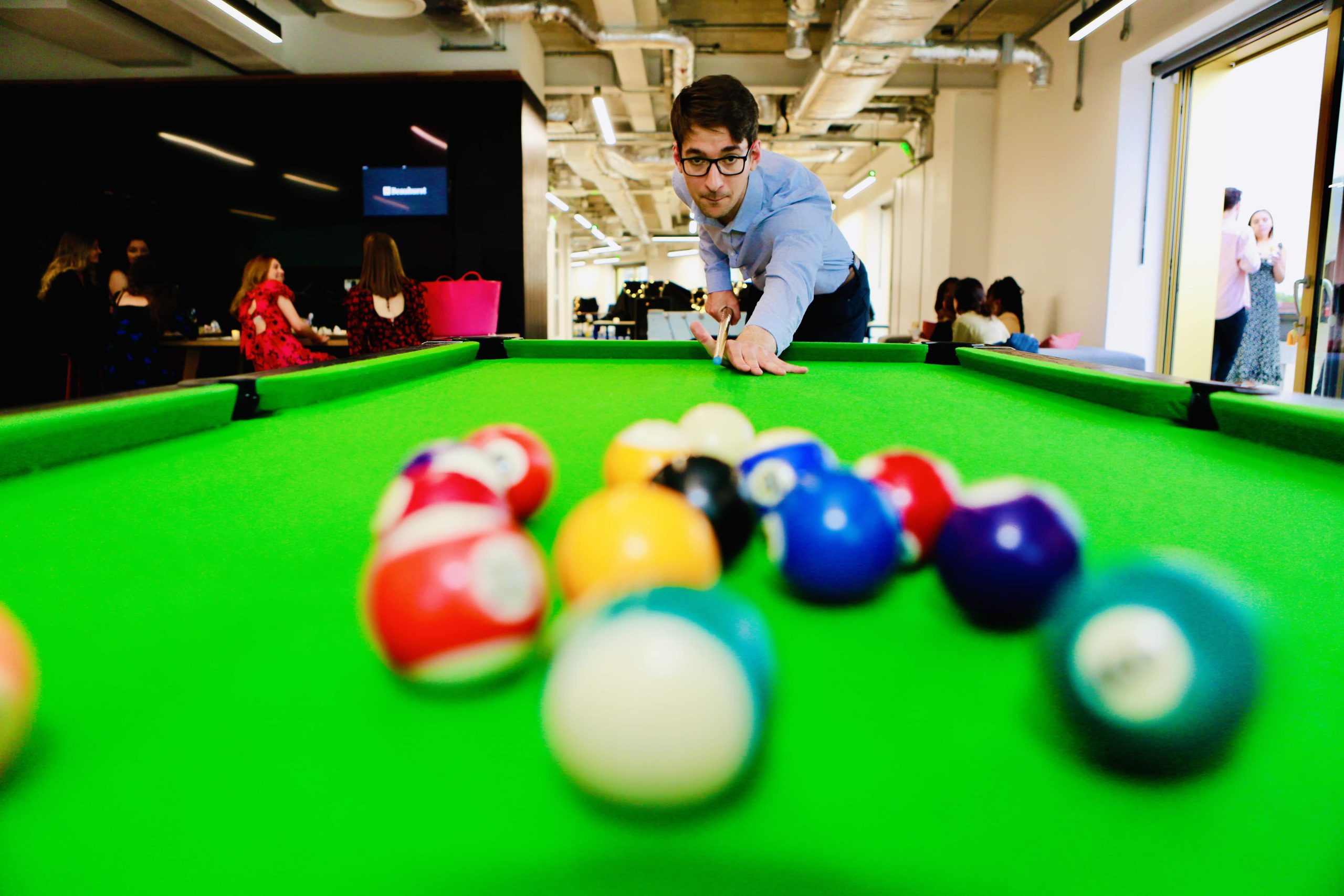 man-playing-pool-colour-photograph